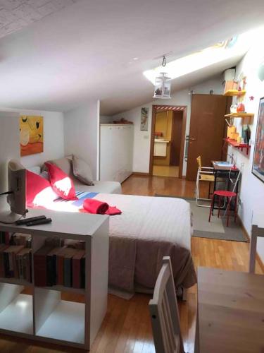 a bedroom with a bed and a desk with a computer at Monolocale A Modo Mio B&B in Bologna
