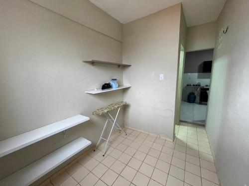 a room with a table and a chair in a room at TV Conego Leitão 2709 ap 203 in Castanhal