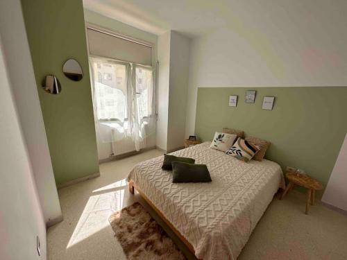 Ein Bett oder Betten in einem Zimmer der Unterkunft Appartement fonctionnel proche de tout