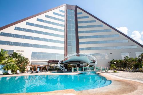 a hotel with a pool and a water slide at Eurobuilding Hotel & Suites Guayana in Puerto Ordaz