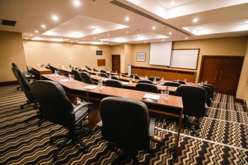 a large meeting room with a long table and chairs at Eurobuilding Hotel & Suites Guayana in Puerto Ordaz