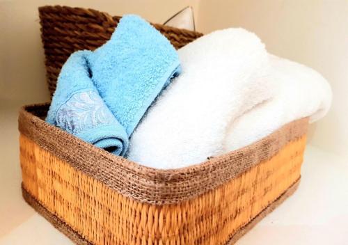 a basket filled with towels on a table at The Marsa story in La Marsa