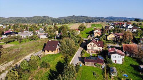 an aerial view of a small village with houses at Domek u wrót Bieszczad in Trepcza