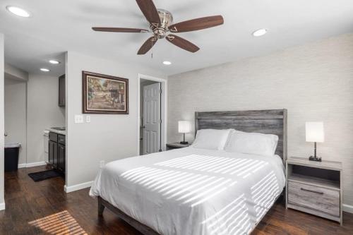a bedroom with a bed and a ceiling fan at Downtown Kimmswick Room~Renovated~Prime Location in Imperial