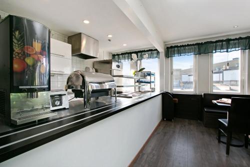 Kuchyň nebo kuchyňský kout v ubytování Brunnby Hotel