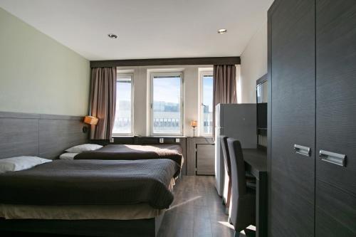 Postel nebo postele na pokoji v ubytování Brunnby Hotel