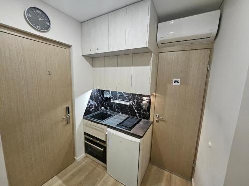 Η κουζίνα ή μικρή κουζίνα στο Kauno Apartamentai su balkonu