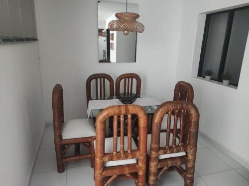 a dining room with a table and four chairs at Habitación en encantadora casa en Itagui in Itagüí