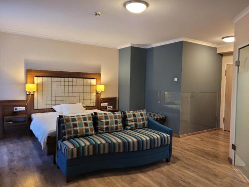 Postel nebo postele na pokoji v ubytování Hotel Number One