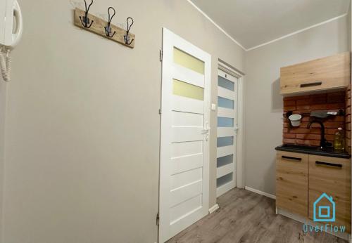 a room with a closet and a door at Jager Room 10 Min to Old Town Gdańsk,PKP & Shopping Mall in Gdańsk