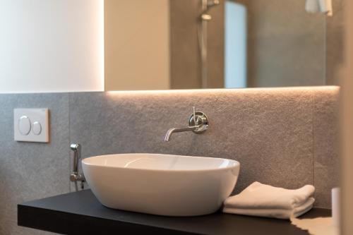 a white bowl sink on a counter in a bathroom at Plarserhof in Lagundo