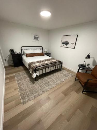 a bedroom with a bed and a rug at Rockwell Commons 