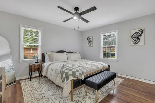a bedroom with a bed and a ceiling fan at Statesboro Sunshine Retreat in Statesboro