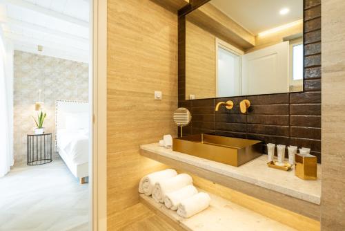 a bathroom with a sink and a mirror at PARGA Villas Collection in Parga