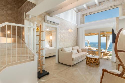 a junior suite with a view of the ocean at PARGA Villas Collection in Parga