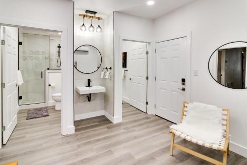 a white bathroom with a sink and a mirror at Serene Buffalo Gap Oasis on 4 Secluded Acres! in Abilene