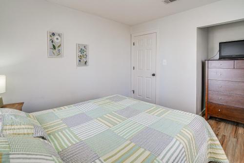 a bedroom with a bed and a dresser at Waterfront Louisiana Home with Private Boat Launch! in Alliance