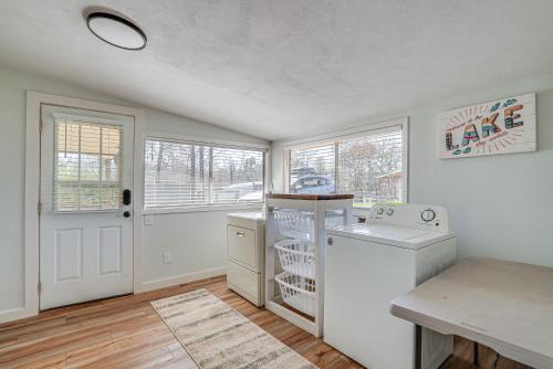 a white laundry room with a washer and dryer at Waterfront Louisiana Home with Private Boat Launch! in Alliance