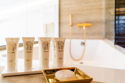 a bathroom with a tub and a group of toiletries at PARGA Villas Collection in Parga