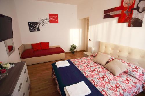 a bedroom with a bed and a couch in it at Sorrento 319 in Sorrento
