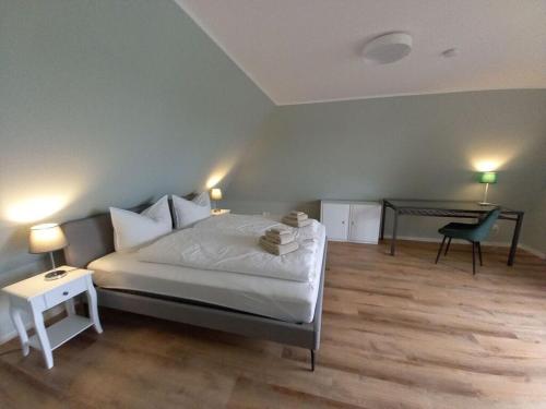 Una cama o camas en una habitación de Holiday home at the end of the Weser