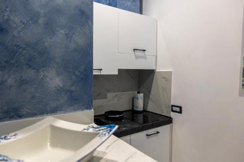 Η κουζίνα ή μικρή κουζίνα στο AETERNA SUITES SPA Apartment