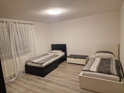 Кровать или кровати в номере Ferienwohnung Sumi