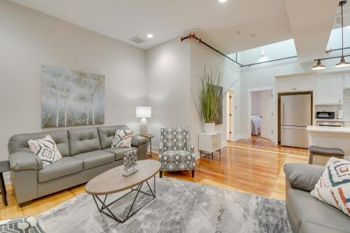 a living room with a couch and a table at Spacious Downtown Hot Springs Vacation Rental! in Hot Springs