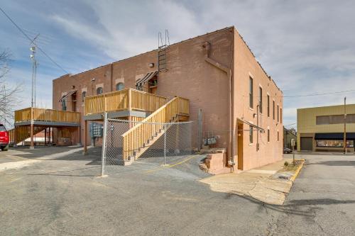 a brick building with a fence in front of it at Spacious Downtown Hot Springs Vacation Rental! in Hot Springs