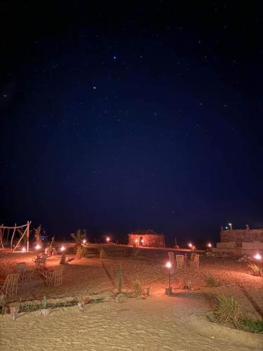 a desert at night with a starry sky at Hayaat siwa hot spring in Siwa