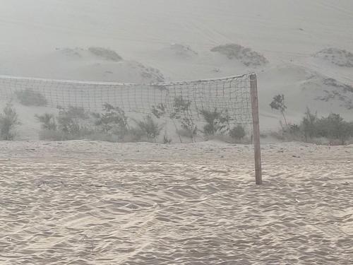 a volleyball net in the sand on a beach at Hayaat siwa hot spring in Siwa
