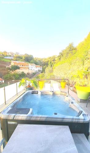 a large swimming pool sitting on top of a patio at Espirito do Mar - Premium Villa with Jacuzzi in Estreito da Calheta