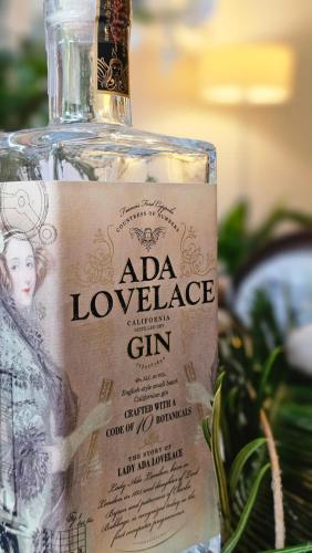 a bottle of aldoria gin sitting next to a plant at BE Jardin Escondido By Coppola in Buenos Aires