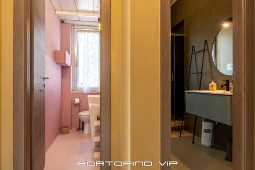 a bathroom with a sink and a toilet and a mirror at Casa Gelsomini by PortofinoVip in Santa Margherita Ligure