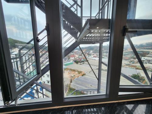 a view from the top of the tower looking out at the city at Happy Bun Hotel Da Lat in Da Lat