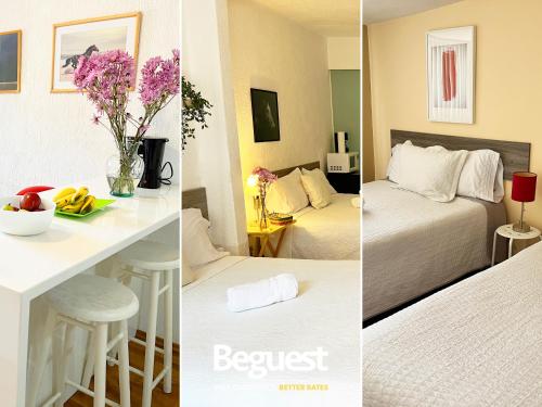 a hotel room with two beds and a table with flowers at Beguest Centro Concerts & Events in Mexico City