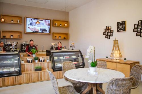 a dining room with a table and people in a restaurant at Royal Solaris Los Cabos - All Inclusive in San José del Cabo