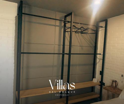 a sliding glass closet door in a bedroom at Villas del Bosque in El Pueblito