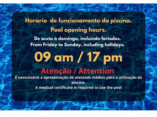 a flyer for a pool opening hours at Lindo Apartamento perto da praia in Rio das Ostras