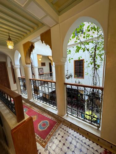 an empty lobby of a house with an archway at Riad Zahri in Marrakesh
