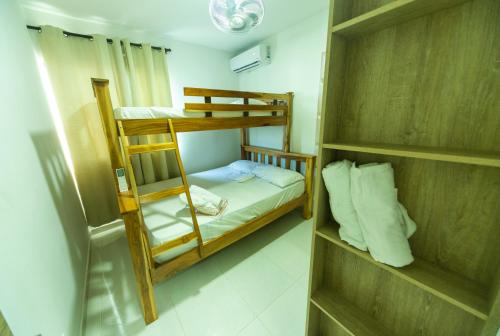 a small room with two bunk beds in it at Acogedor Piso 5 in Cartagena de Indias