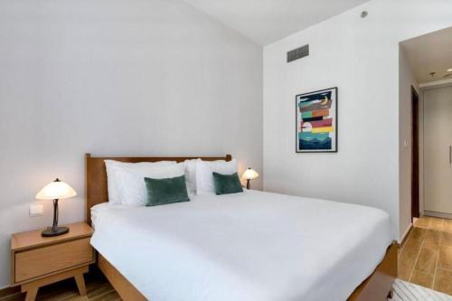 Säng eller sängar i ett rum på Apartament Great view Dubai