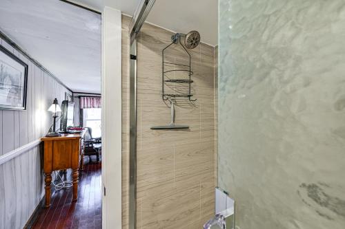 a shower in a room with a wooden wall at Cleveland Home with South Saluda Fishing Access in Cleveland
