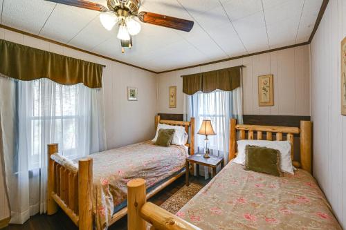 a bedroom with two beds and a ceiling fan at Cleveland Home with South Saluda Fishing Access in Cleveland