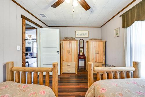 a bedroom with two beds and a table and cabinets at Cleveland Home with South Saluda Fishing Access in Cleveland