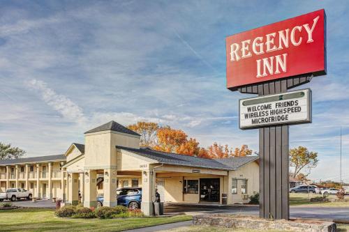 a sign in front of areagency inn at Regency Inn in Fayetteville