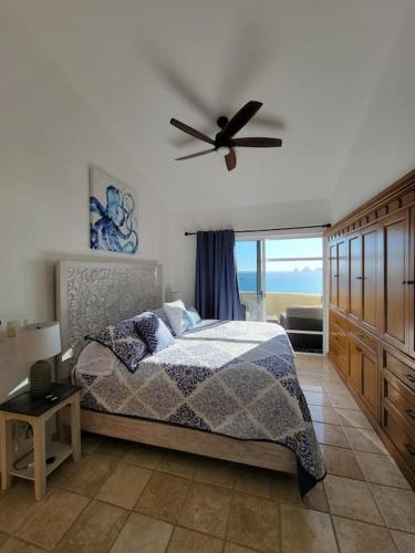a bedroom with a bed and a ceiling fan at Oceanfront Penthouse, 2 Masters, 2 Baths, kitchen! in Cabo San Lucas