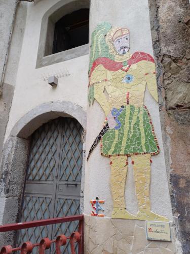 a painting of a woman on the side of a building at Etnalcantara in Castiglione di Sicilia