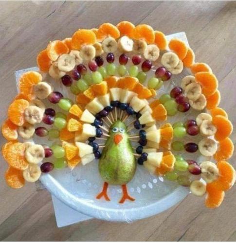 a cake with a turkey on a plate of fruit at OceanAire Crest @ Oceanpointe in Lucea