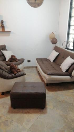 a living room with two couches and a couch at VILLA DEL SOL PURIFICACIÓN TOLIMA in Purificación